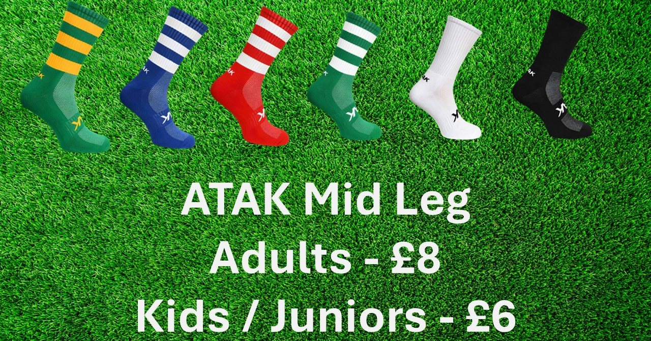 Collection of socks on a grass background with ATAK branding and pricing information.