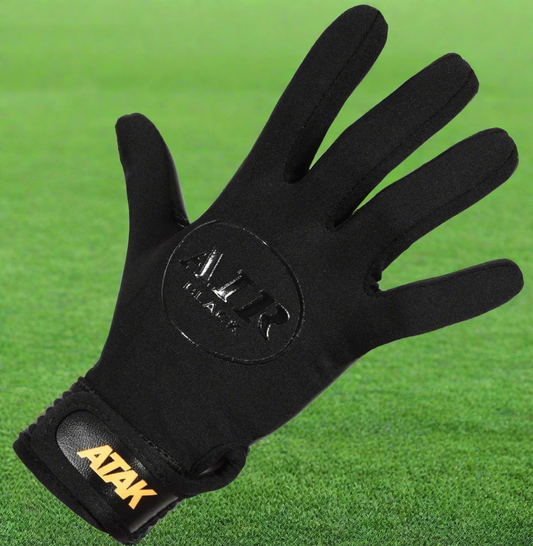Blackout ATAK air gloves on a green grass background