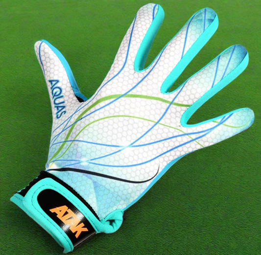 ATAK Aquas gloves on a green grass background