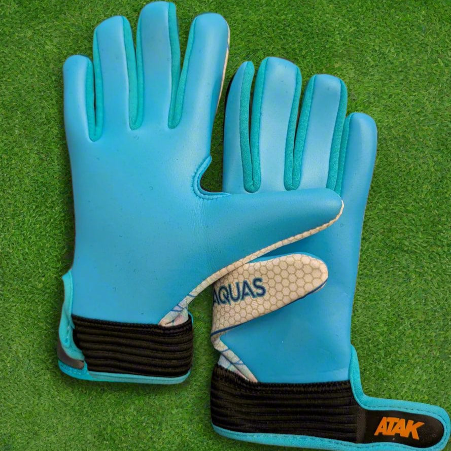 ATAK Aquas gloves on a green grass background