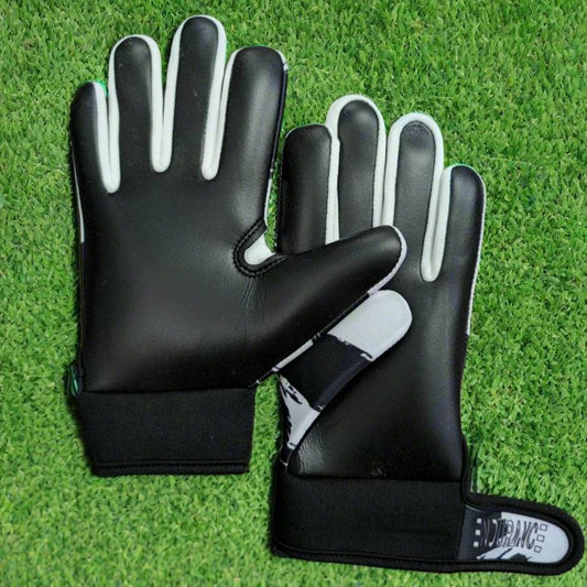 Black and white Endurance Leisure gloves on a green grass background