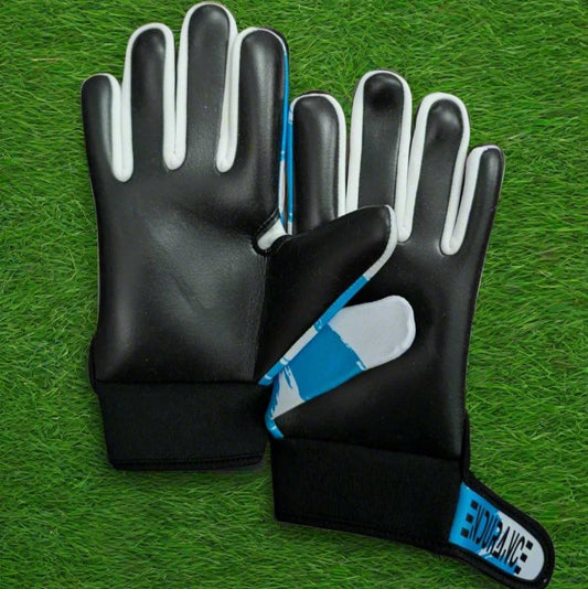 Blue and white Endurance Leisure gloves on a green grass background