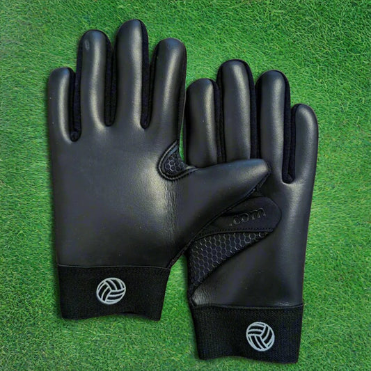 Blackout Fetch V1 gloves on a green grass background