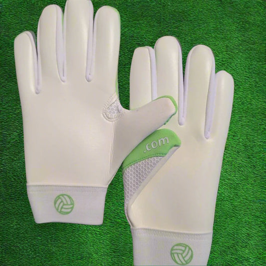 Lime green and white Fetch V1 gloves on a green grass background