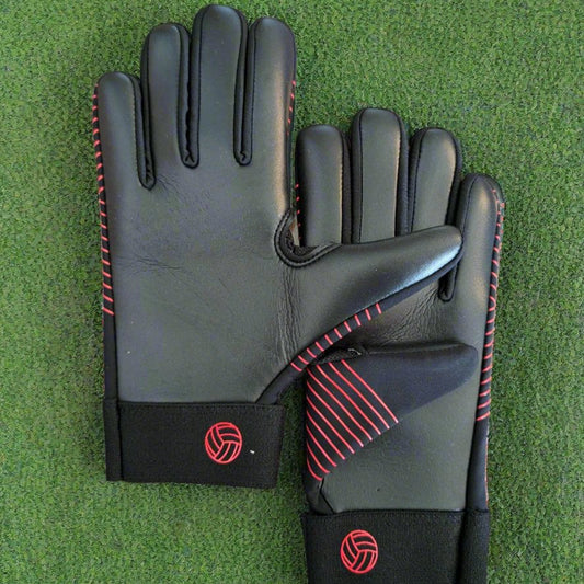 Black and red Straight edge strapless gloves on a green grass background