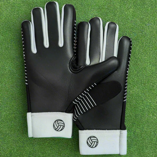 Black and white Straight edge strapless gloves on a green grass background