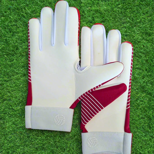 Red and white Straight edge strapless gloves on a green grass background