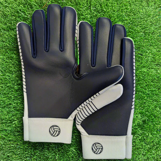 White and navy Straight edge strapless gloves on a green grass background