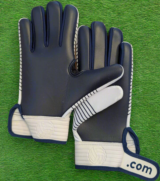 White and navy Straight edge strapped gloves on a green grass background