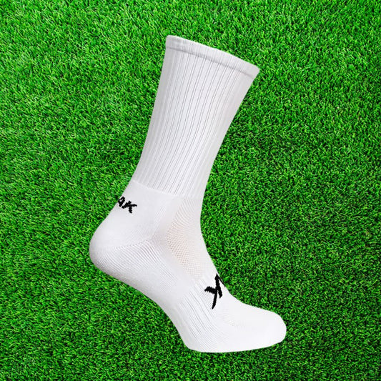 White ATAK sock on a green grass background