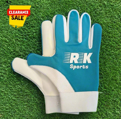 Blue RK sports gloves on a green grass background with a clearance sticker